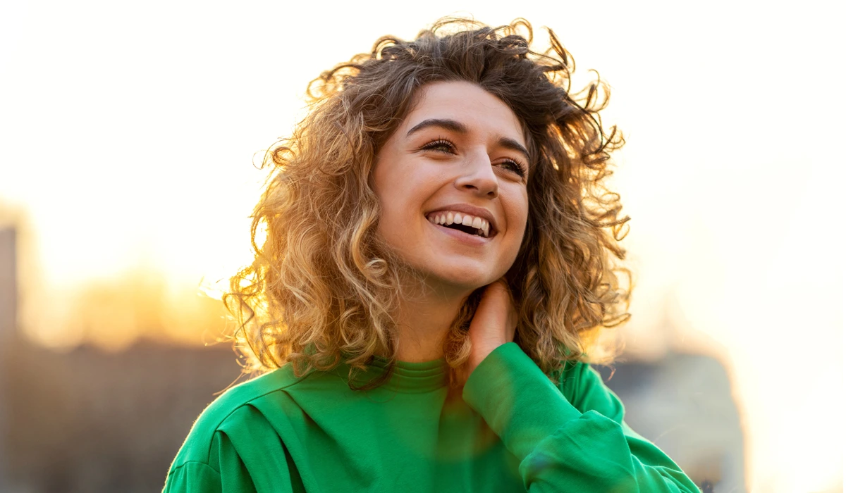 restylane-filler-flexibility A person with a natural, expressive smile, highlighting the flexible and subtle results that make Restylane stand out.