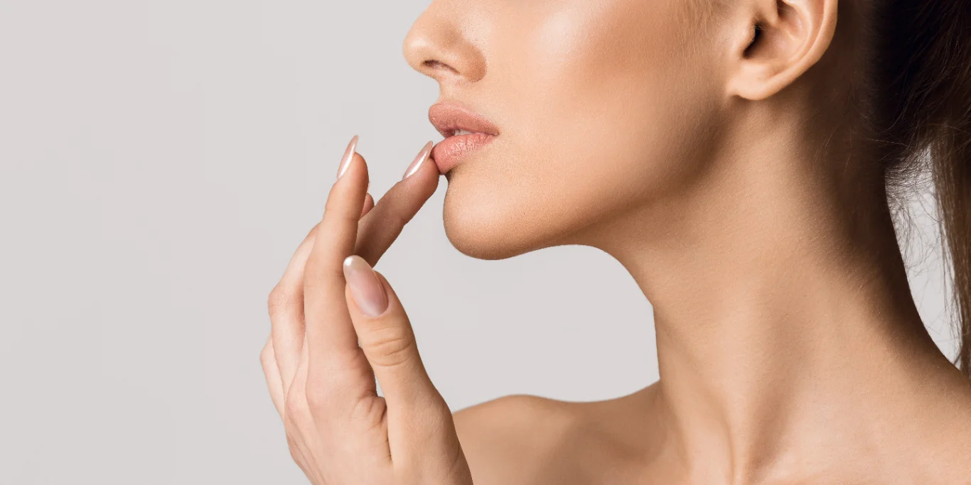 Beautiful girl touching her lips