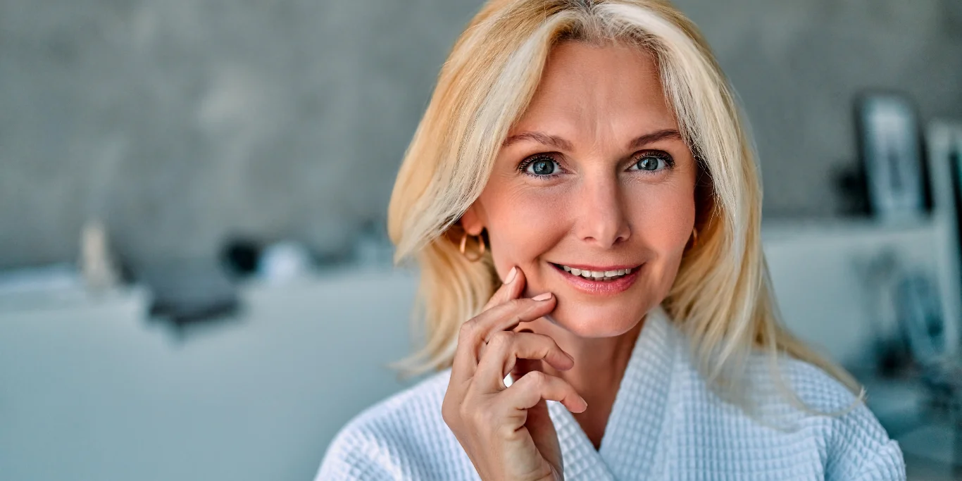 blonde woman robe spa